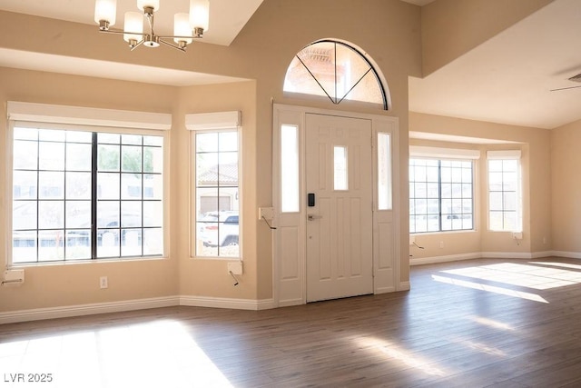 904 Swift Bear St, Henderson, NV 89002 - entrance foyer featuring a chandelier, wood finished floors, and plenty of natural light