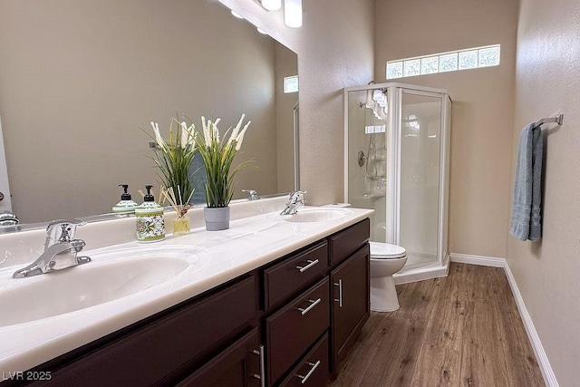 904 Swift Bear St, Henderson, NV 89002 - bathroom with wood finished floors, a stall shower, and double vanity