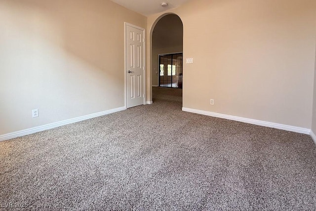 904 Swift Bear St, Henderson, NV 89002 - empty room featuring arched walkways and carpet