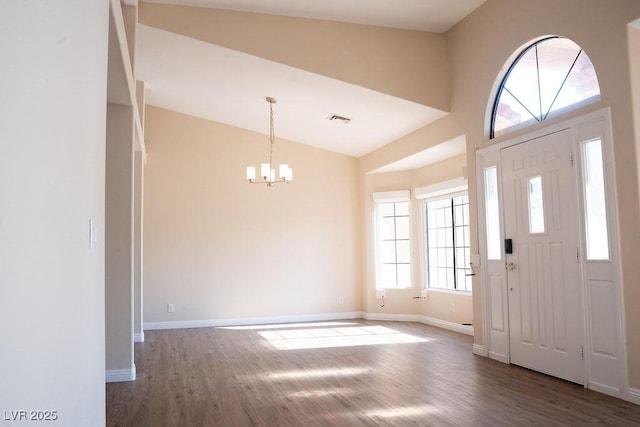 904 Swift Bear St, Henderson, NV 89002 - entrance foyer with a chandelier, wood finished floors, and lofted ceiling
