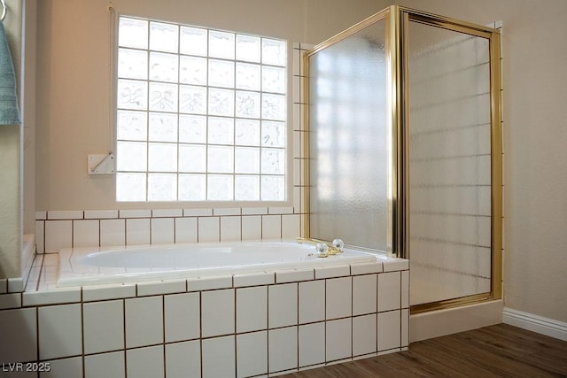 904 Swift Bear St, Henderson, NV 89002 - full bath with a stall shower, a garden tub, and wood finished floors