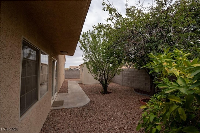 904 Swift Bear St, Henderson, NV 89002 - fenced backyard featuring a storage unit