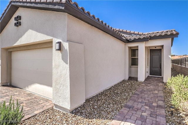 187 Palm Fox Ct, Henderson, NV 89011 - view of side of home featuring a tile roof and stucco siding