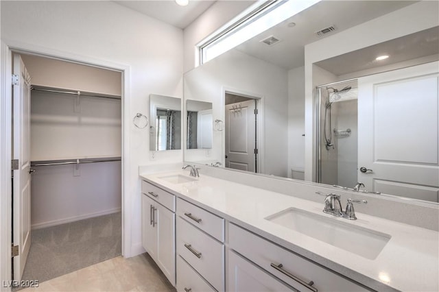 187 Palm Fox Ct, Henderson, NV 89011 - bathroom with double vanity, a shower stall, and a spacious closet