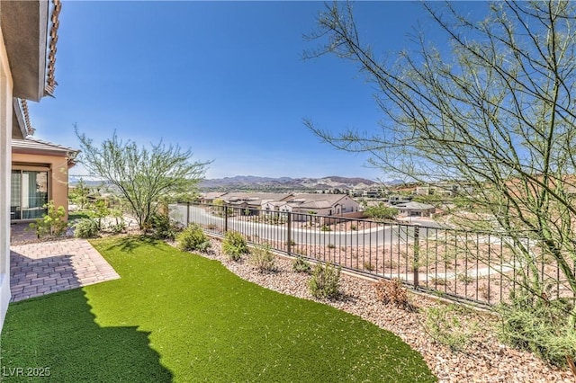 187 Palm Fox Ct, Henderson, NV 89011 - fenced backyard featuring a mountain view and a patio