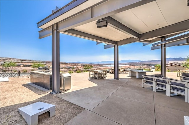 187 Palm Fox Ct, Henderson, NV 89011 - view of patio featuring a mountain view and outdoor dining space