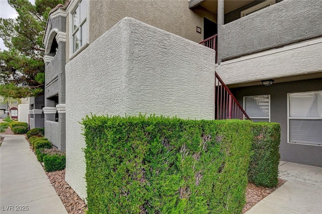 5055 W Hacienda Ave Unit 2003, Las Vegas, NV 89118 - view of side of home with stucco siding