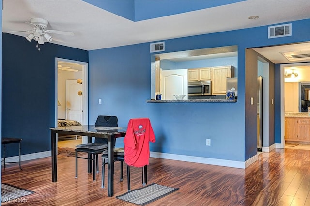 5055 W Hacienda Ave Unit 2003, Las Vegas, NV 89118 - dining area with ceiling fan and wood finished floors