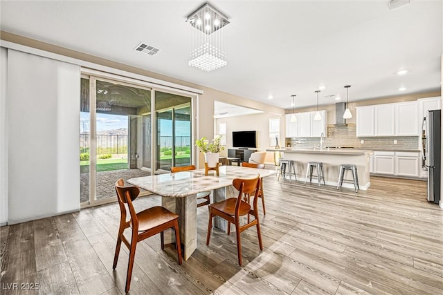 12415 Notch Trail Ave, Las Vegas, NV 89138 - dining area featuring light wood-style floors and recessed lighting