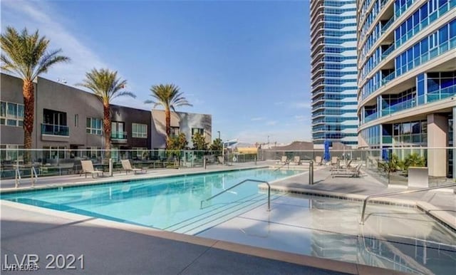 4525 Dean Martin Dr Unit 2203, Las Vegas, NV 89103 - community pool with a patio area