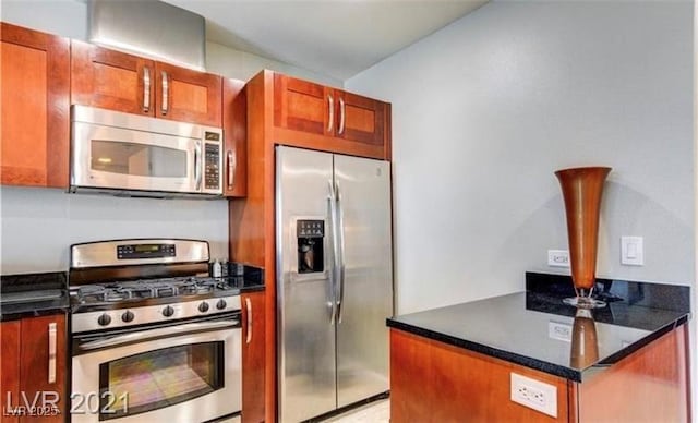 4525 Dean Martin Dr Unit 2203, Las Vegas, NV 89103 - kitchen with appliances with stainless steel finishes and brown cabinets