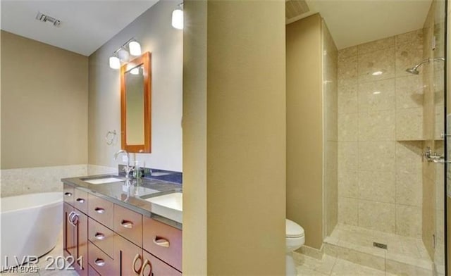 4525 Dean Martin Dr Unit 2203, Las Vegas, NV 89103 - full bathroom featuring double vanity, a garden tub, a shower stall, and tile patterned floors