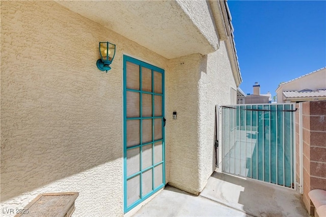 6009 Flowering Plum Ave, Las Vegas, NV 89142 - doorway to property with stucco siding