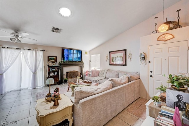 6009 Flowering Plum Ave, Las Vegas, NV 89142 - living room with light tile patterned floors, lofted ceiling, and ceiling fan