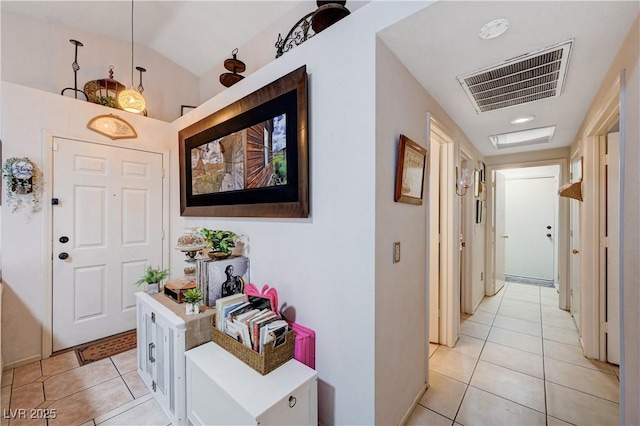 6009 Flowering Plum Ave, Las Vegas, NV 89142 - entrance foyer with light tile patterned flooring and vaulted ceiling