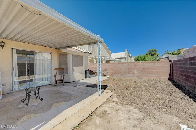 6009 Flowering Plum Ave, Las Vegas, NV 89142 - fenced backyard featuring a patio