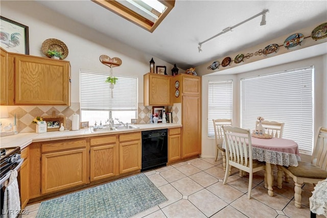 6009 Flowering Plum Ave, Las Vegas, NV 89142 - kitchen featuring dishwasher, stainless steel stove, decorative backsplash, tile counters, and lofted ceiling