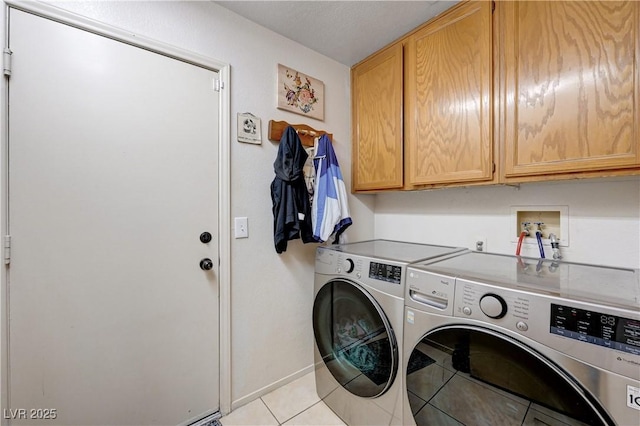 6009 Flowering Plum Ave, Las Vegas, NV 89142 - laundry room with washing machine and dryer, cabinet space, and light tile patterned floors