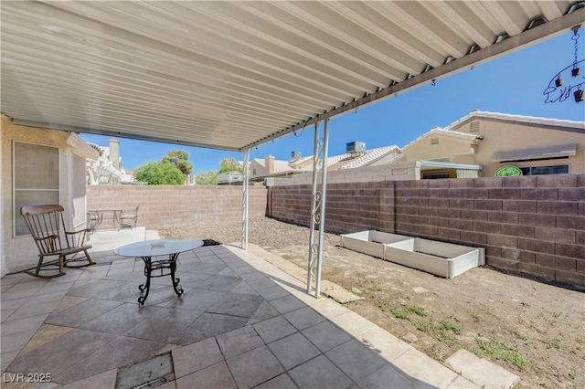 6009 Flowering Plum Ave, Las Vegas, NV 89142 - fenced backyard with a patio area