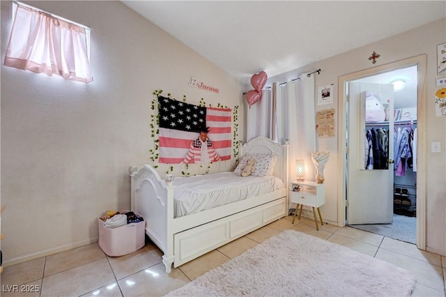 6009 Flowering Plum Ave, Las Vegas, NV 89142 - tiled bedroom featuring lofted ceiling and a walk in closet