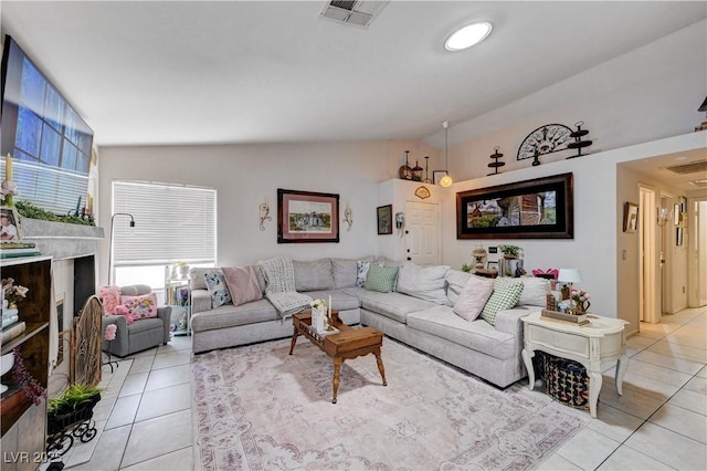 6009 Flowering Plum Ave, Las Vegas, NV 89142 - living area featuring light tile patterned floors and vaulted ceiling