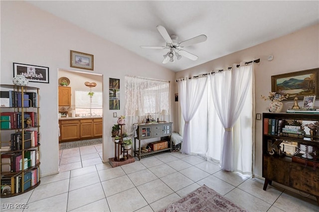 6009 Flowering Plum Ave, Las Vegas, NV 89142 - living area featuring a ceiling fan, lofted ceiling, and light tile patterned flooring
