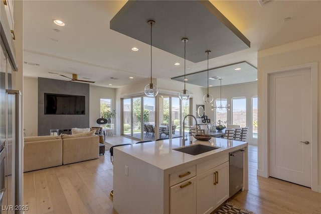 975 Amara Way, Henderson, NV 89052 - kitchen with healthy amount of natural light, light wood finished floors, dishwasher, open floor plan, and recessed lighting