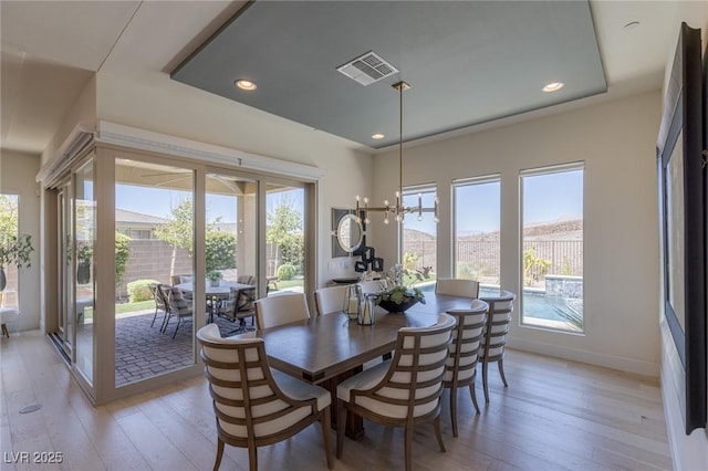 975 Amara Way, Henderson, NV 89052 - dining room featuring healthy amount of natural light, light wood-style flooring, a chandelier, and recessed lighting