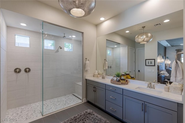975 Amara Way, Henderson, NV 89052 - ensuite bathroom featuring double vanity, a walk in shower, healthy amount of natural light, and recessed lighting