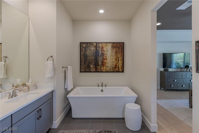 975 Amara Way, Henderson, NV 89052 - full bathroom with vanity, a freestanding tub, and recessed lighting