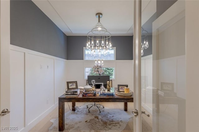 975 Amara Way, Henderson, NV 89052 - home office featuring a chandelier, a decorative wall, a wainscoted wall, and wood finished floors