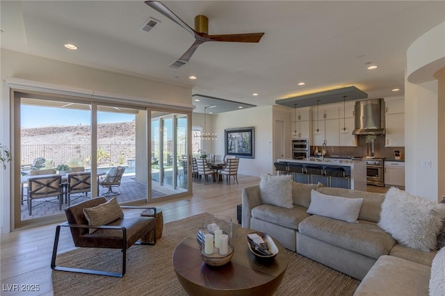 975 Amara Way, Henderson, NV 89052 - living area featuring light wood-style floors, ceiling fan, and recessed lighting