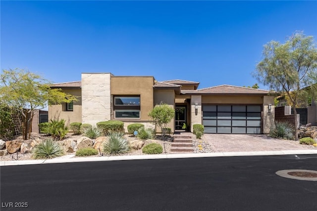 975 Amara Way, Henderson, NV 89052 - view of front facade featuring a garage, stucco siding, and driveway