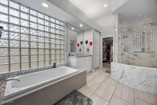 108 Valiente St, Las Vegas, NV 89144 - full bath featuring a shower stall, a bath, a spacious closet, vanity, and recessed lighting