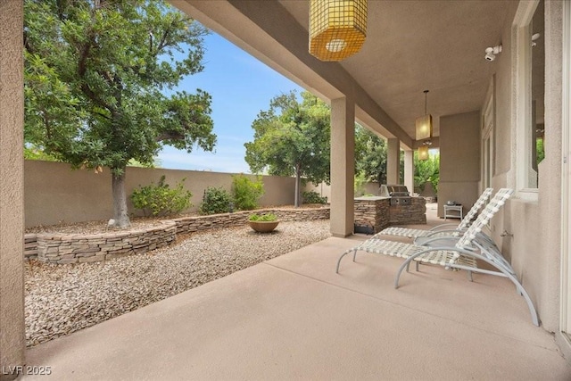 108 Valiente St, Las Vegas, NV 89144 - fenced backyard with exterior kitchen and a patio area