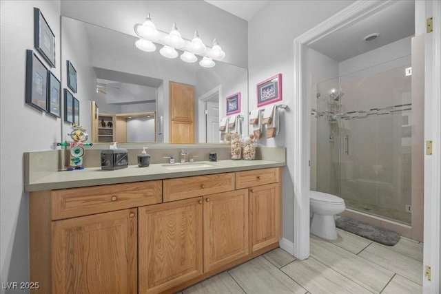 108 Valiente St, Las Vegas, NV 89144 - bathroom with a shower stall, vanity, and wood finish floors