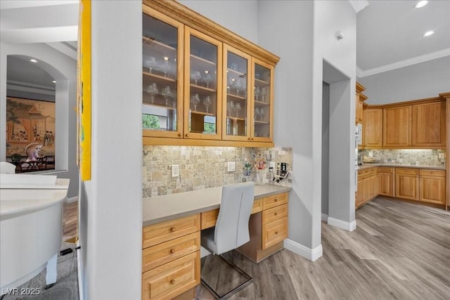 108 Valiente St, Las Vegas, NV 89144 - office space with built in desk, ornamental molding, light wood finished floors, arched walkways, and recessed lighting