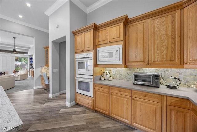 108 Valiente St, Las Vegas, NV 89144 - kitchen featuring white appliances, ornamental molding, tasteful backsplash, dark wood-style flooring, and light countertops