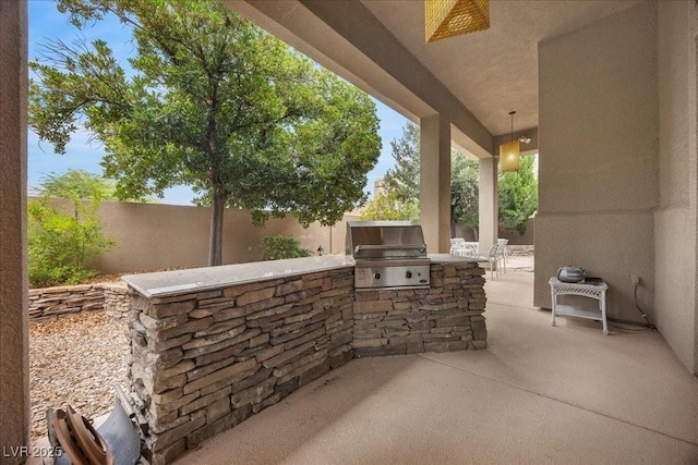 108 Valiente St, Las Vegas, NV 89144 - fenced backyard featuring exterior kitchen, a patio, and a ceiling fan