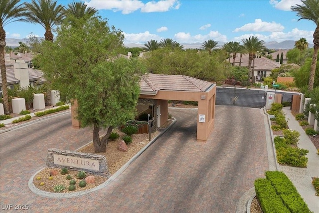108 Valiente St, Las Vegas, NV 89144 - view of decorative road featuring a gate, curbs, sidewalks, and a gated entry