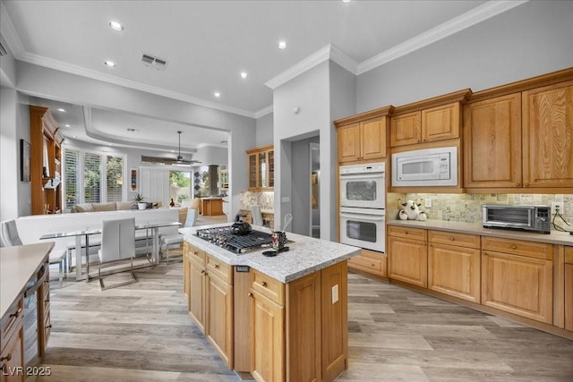 108 Valiente St, Las Vegas, NV 89144 - kitchen featuring white appliances, light wood-style flooring, light countertops, backsplash, and open floor plan