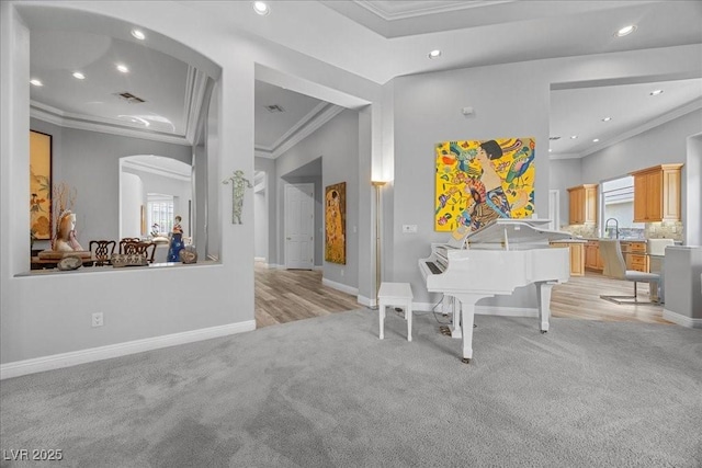 108 Valiente St, Las Vegas, NV 89144 - playroom with light colored carpet, arched walkways, ornamental molding, and recessed lighting