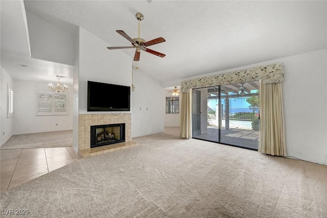 454 Intrepid Ct, Boulder City, NV 89005 - unfurnished living room featuring carpet flooring, ceiling fan, a tile fireplace, a chandelier, and tile patterned floors