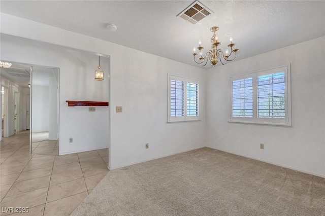 454 Intrepid Ct, Boulder City, NV 89005 - spare room featuring a chandelier, light tile patterned flooring, and light carpet