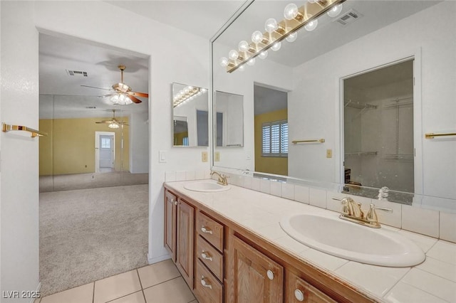 454 Intrepid Ct, Boulder City, NV 89005 - bathroom featuring double vanity, ceiling fan, tile patterned flooring, and a spacious closet