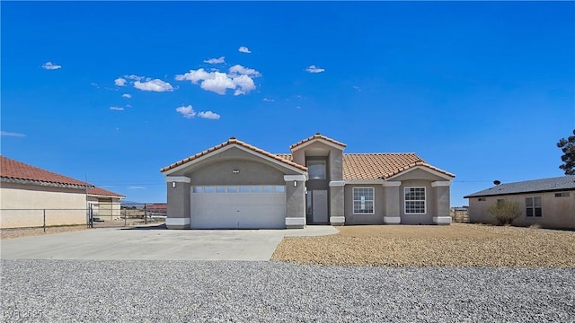 3326 Mount Charleston Dr, Pahrump, NV 89048 - view of front facade featuring stucco siding, a tile roof, an attached garage, and concrete driveway