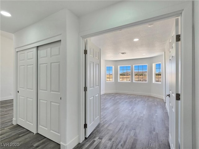 3326 Mount Charleston Dr, Pahrump, NV 89048 - hall featuring dark wood-type flooring, a textured ceiling, and recessed lighting