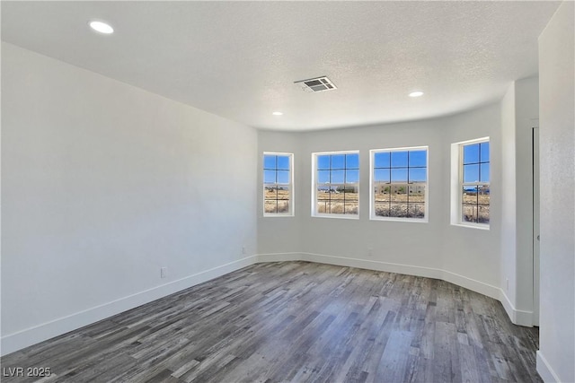 3326 Mount Charleston Dr, Pahrump, NV 89048 - unfurnished room featuring wood finished floors, recessed lighting, and a textured ceiling