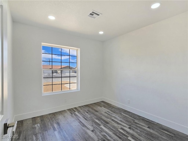 3326 Mount Charleston Dr, Pahrump, NV 89048 - unfurnished room with dark wood-style floors, recessed lighting, and a baseboard radiator