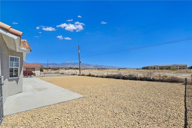 3326 Mount Charleston Dr, Pahrump, NV 89048 - fenced backyard featuring a mountain view and a patio